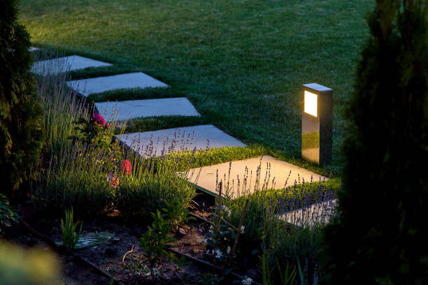 stone work brick fire pit at apartment complex surrounded by gravel and brick seating 